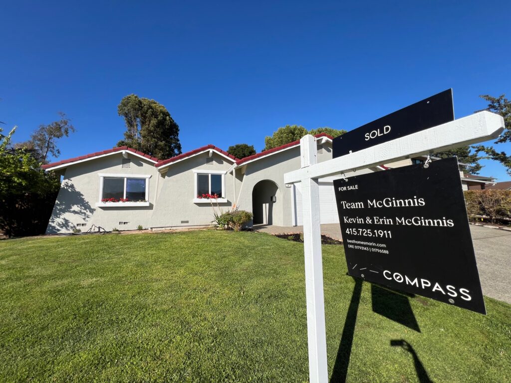 Real estate for sale sign from Team McGinnis Realtors at Compass